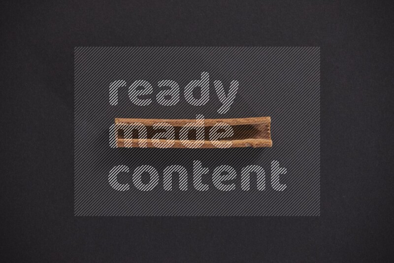 Cinnamon stick on black background