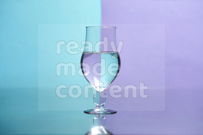 The image features a clear glassware filled with water, set against light blue and light purple background