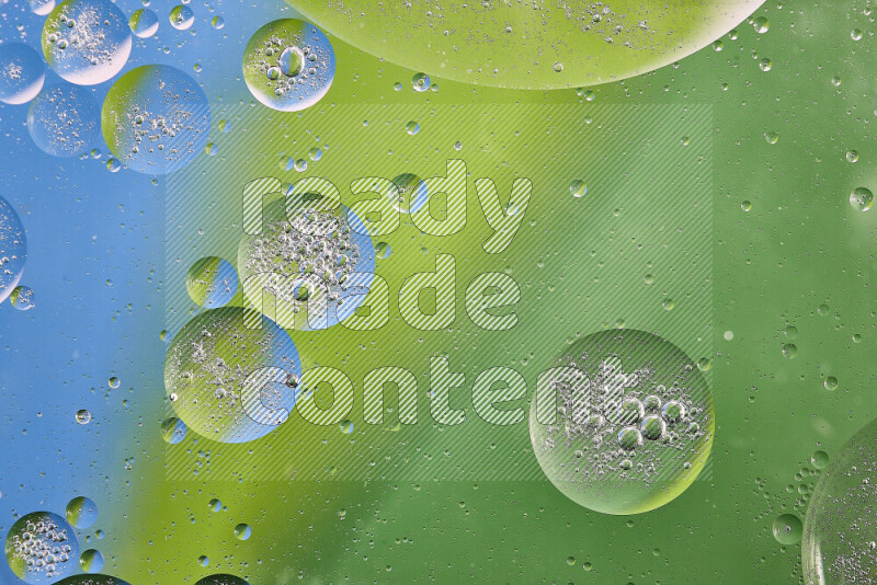 Close-ups of abstract oil bubbles on water surface in shades of green and blue