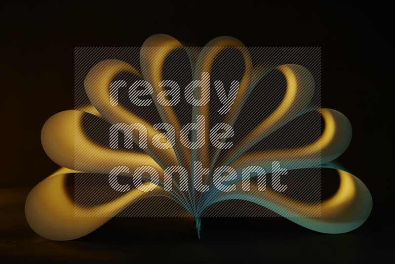 فن تجريدي يعرض منحنيات وتدرجات اللون الأصفر والأخضر مكونه بضوء ملون