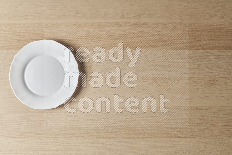 Top View Shot Of A White Ceramic Circular Plate on Oak Wooden Flooring