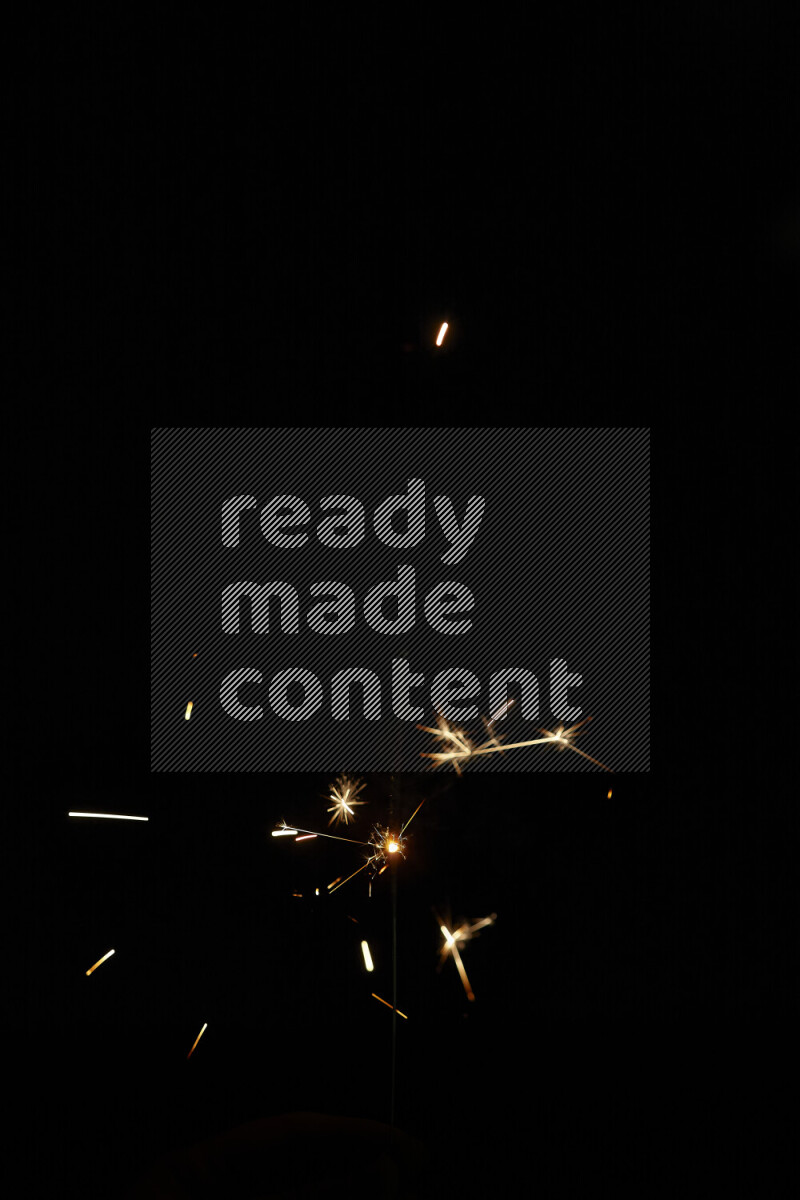 A close-up image of sparkler candle isolated on black background