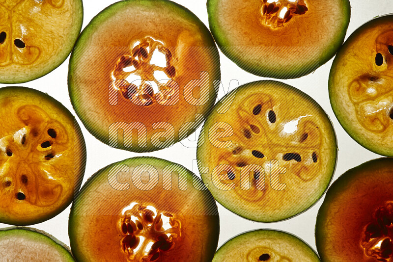 Watermelon slices on illuminated white background