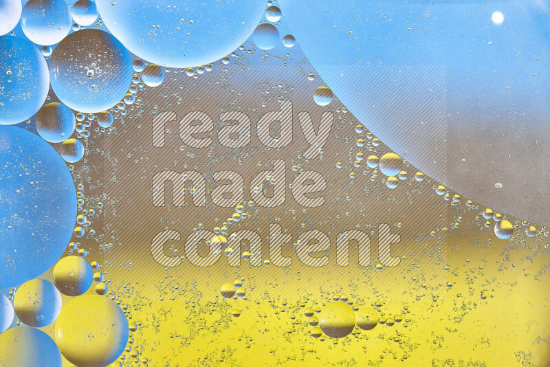 Close-ups of abstract oil bubbles on water surface in shades of yellow, brown and blue