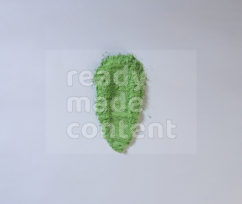 Green powder strokes on white background