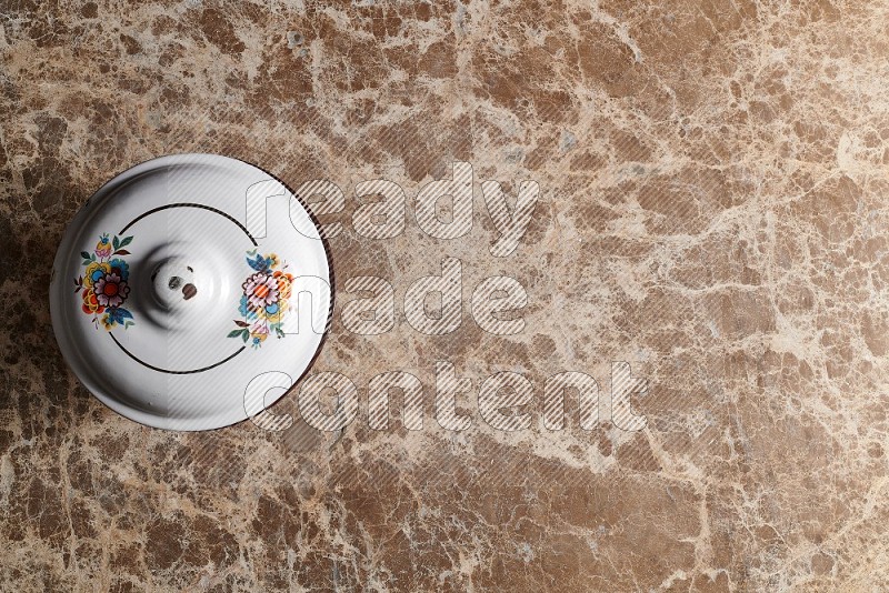 Top View Shot Of A Vintage pot On beige Marble Flooring