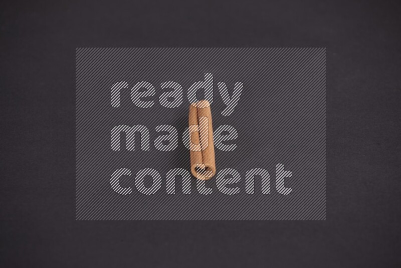 Cinnamon stick on black background