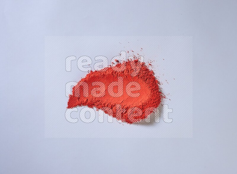 Red powder strokes on white background