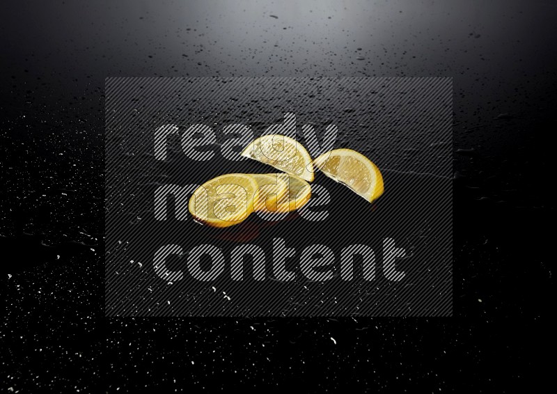 Lemon slices with water drops, and droplets on black background