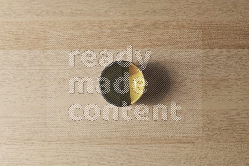 Top View Shot Of A Multicolored Pottery Bowl on Oak Wooden Flooring