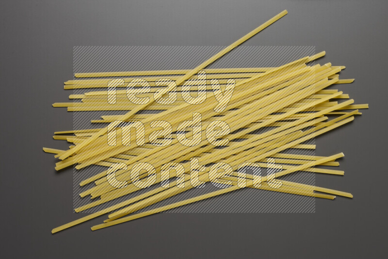Linguini pasta on grey background
