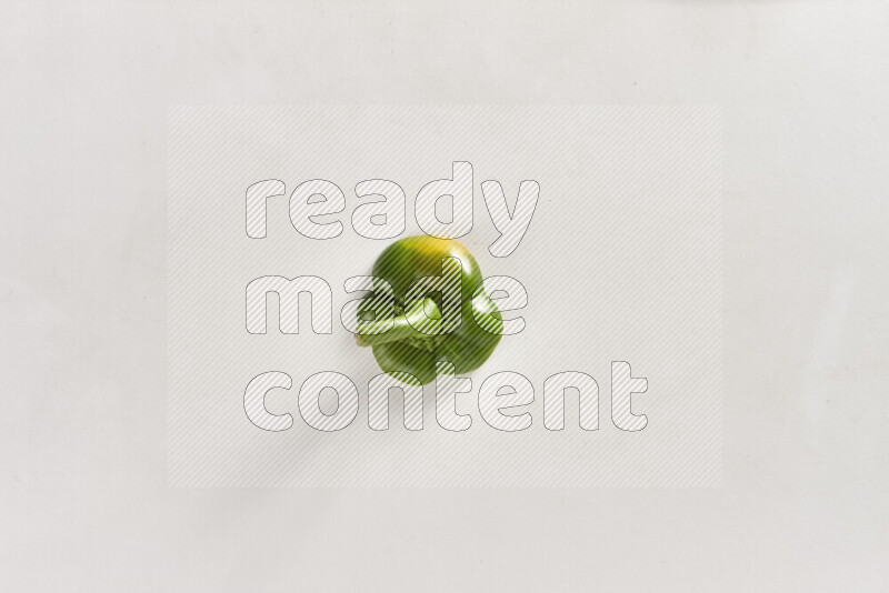 Green bell pepper slices on white background