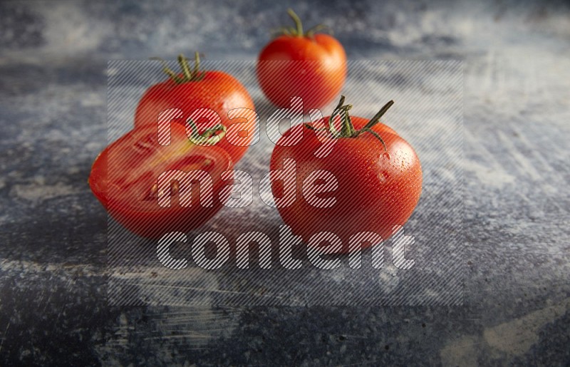 45 degree roma tomato on a textured rustic blue background