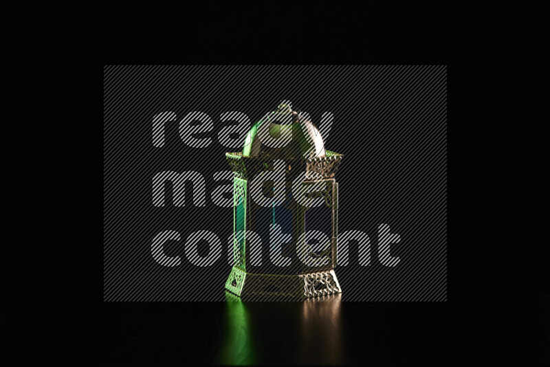 Ramadan lanterns with colored rim light against black background