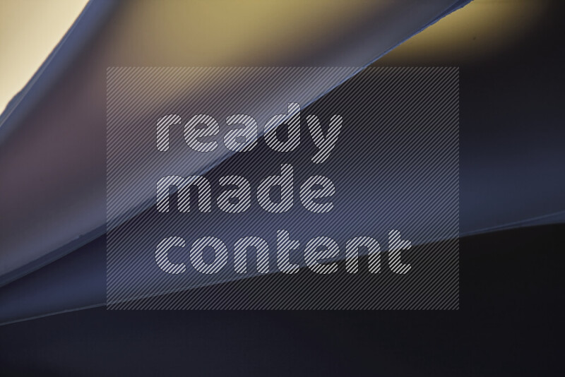 An abstract art piece displaying smooth curves in warm and cold gradients created by colored light