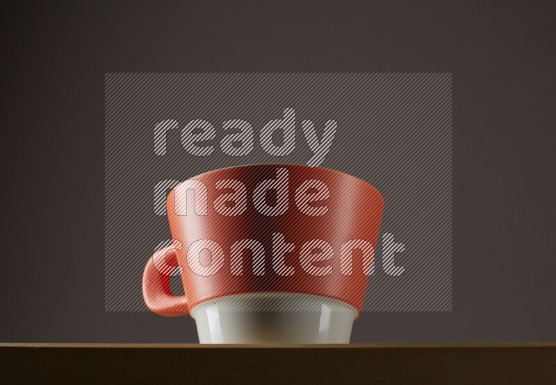 Low angle shot of a bicolor cup on grey background