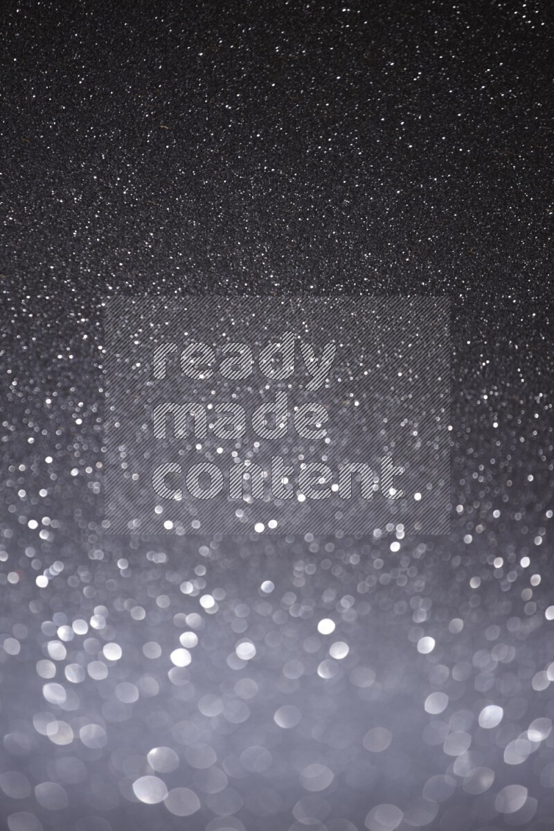 Black glittery bokeh background