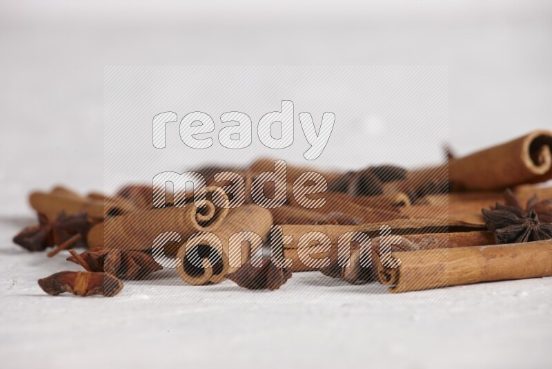 cinnamon sticks with star anise on white background
