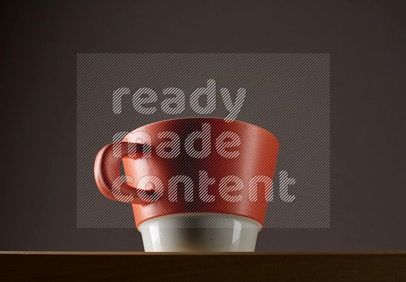 Low angle shot of a bicolor cup on grey background