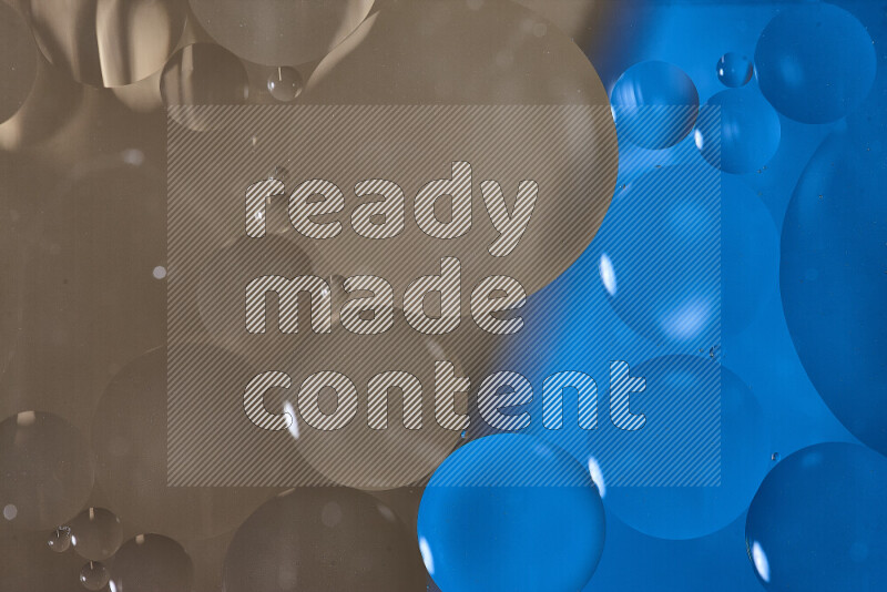 لقطات مقربة لفقاعات من الزيت على سطح الماء باللون الأزرق والبني