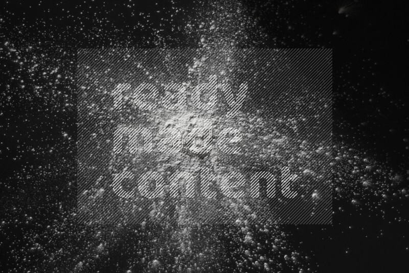 White powder explosion on black background