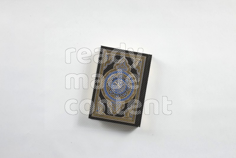 Quran with a prayer beads on white background