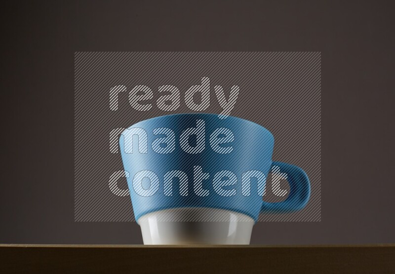 Low angle shot of a bicolor cup on grey background