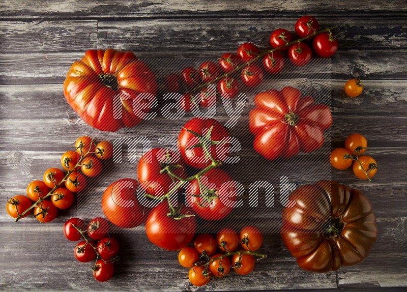 Mixed Tomatoes types topview on a textured vinyl backgrounds