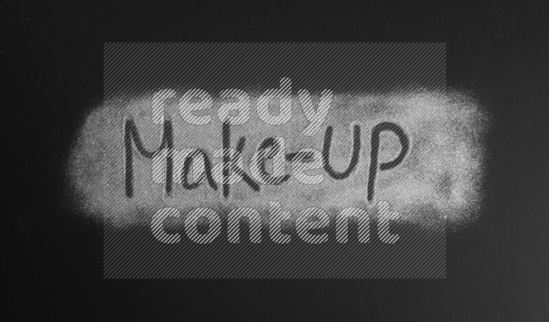 A sentence written with silver glitter on black background