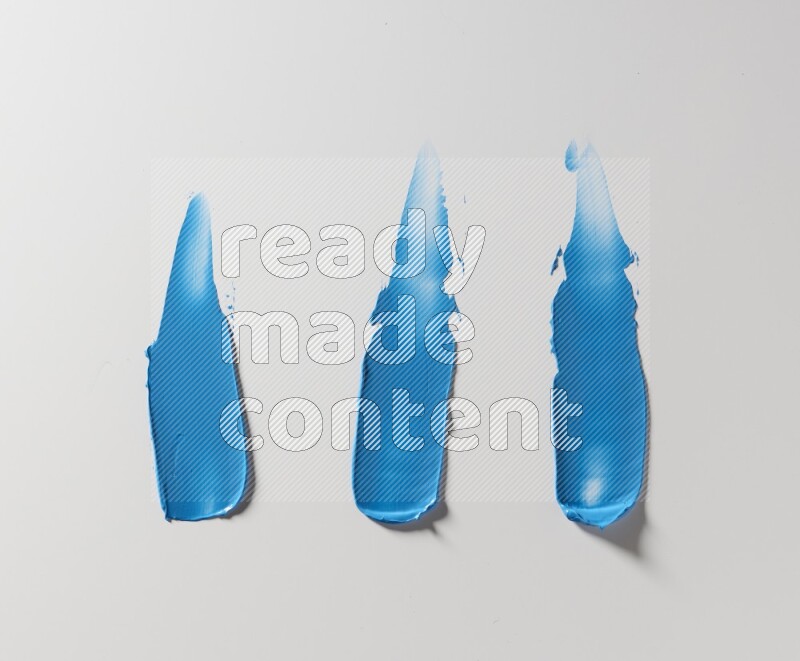 Blue painting knife strokes on white background