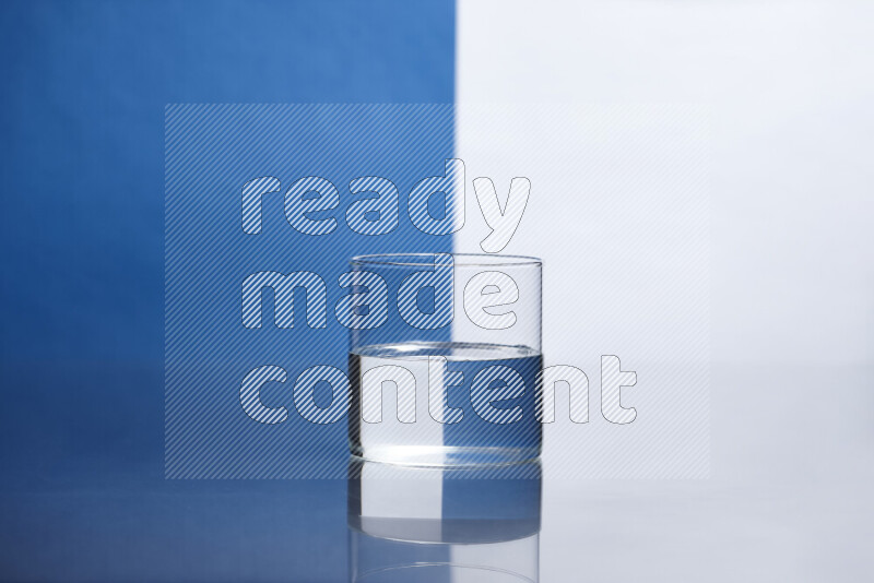 The image features a clear glassware filled with water, set against white and blue background