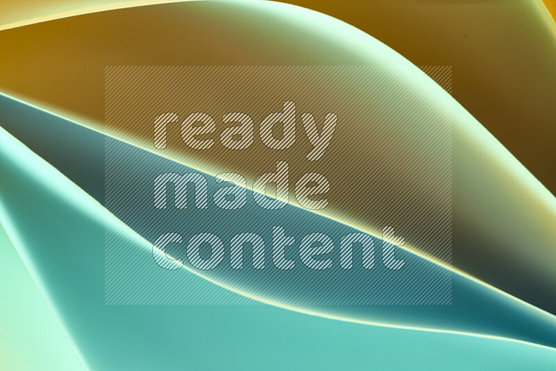 هذه الصورة تعرض تكوين فن الورق التجريدي مع منحنيات ورقية بتدرجات اللون الأخضر والبرتقالي المكونه بواسطة الضوء الملون