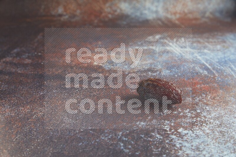 one madjoul date on a rustic reddish background