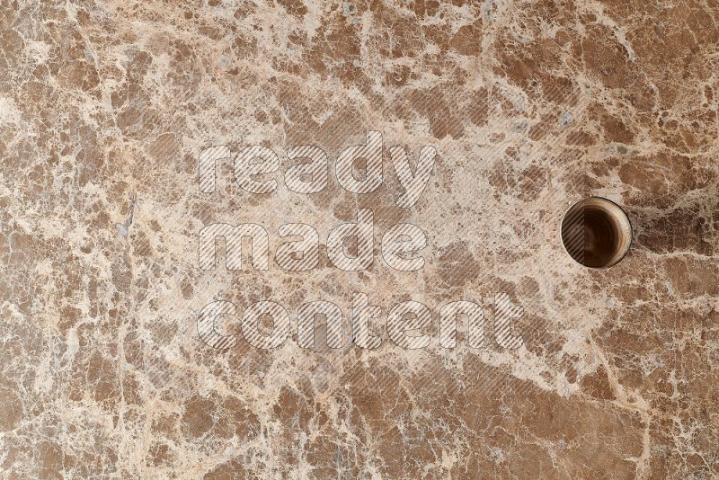 Top View Shot Of A Pottery Cup On beige Marble Flooring
