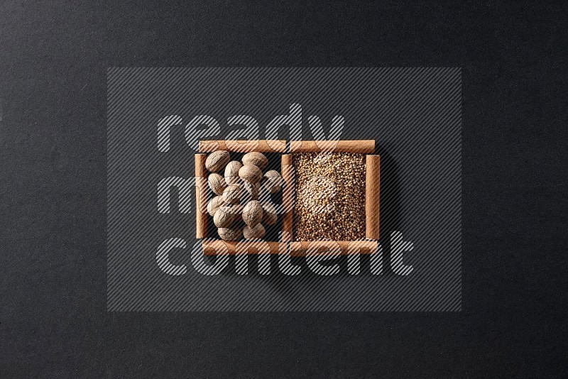 2 squares of cinnamon sticks full of mustard seeds and nutmeg on black flooring