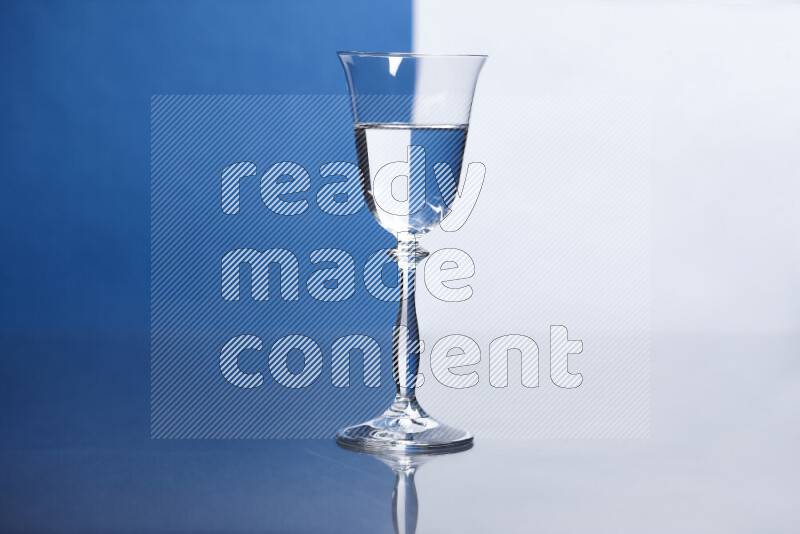 The image features a clear glassware filled with water, set against white and blue background