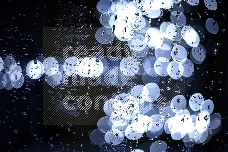 Bokeh light in white with water drops