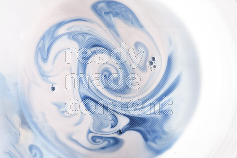 A close-up of abstract swirling patterns in blue and white