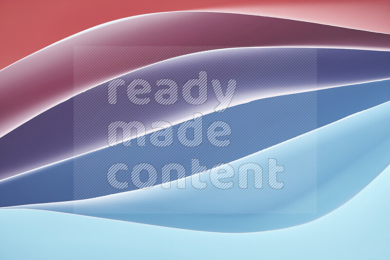 This image showcases an abstract paper art composition with paper curves in blue and red gradients created by colored light