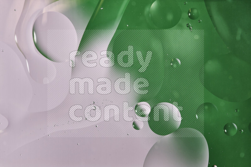 Close-ups of abstract oil bubbles on water surface in shades of white and green