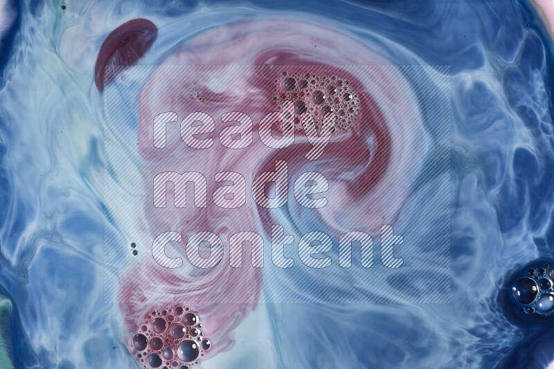 لقطة مقربة لأنماط دوامية باللون الأزرق والأحمر والأبيض