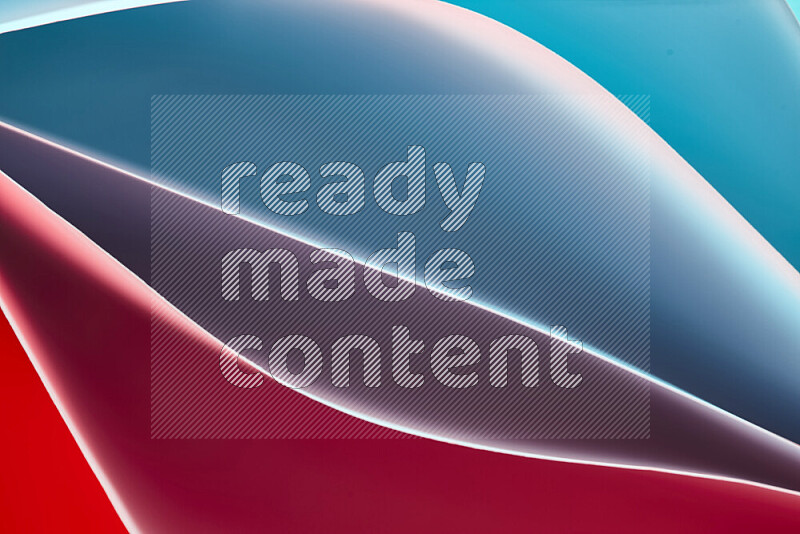 This image showcases an abstract paper art composition with paper curves in blue and red gradients created by colored light