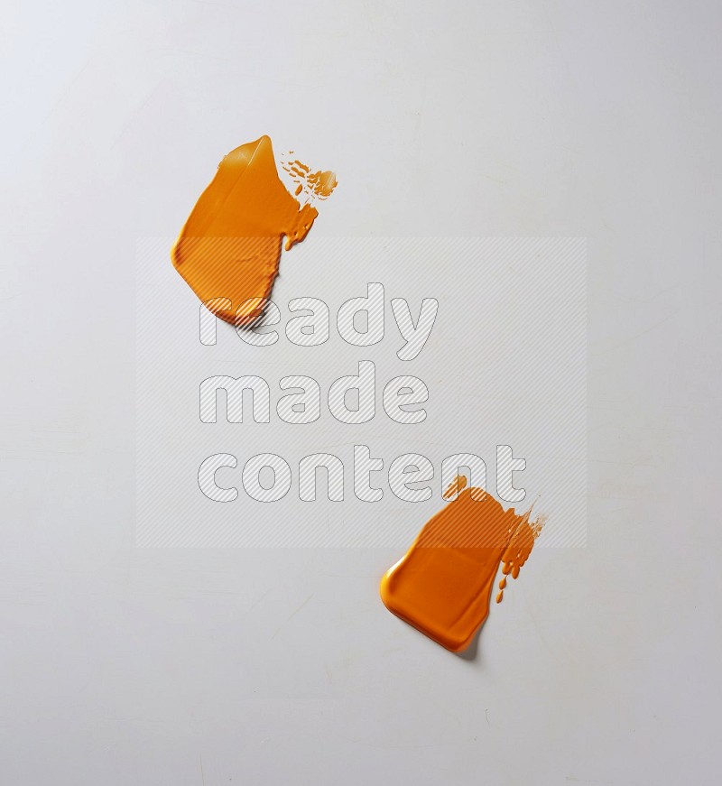 Orange painting knife strokes on white background