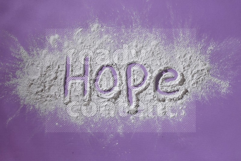 A word written with powder on purple background