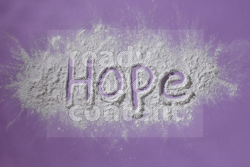 A word written with powder on purple background