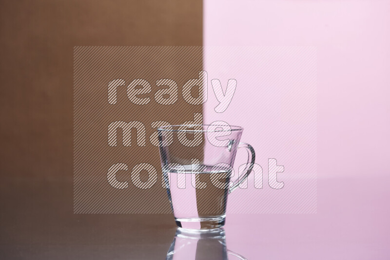 The image features a clear glassware filled with water, set against brown and rose background