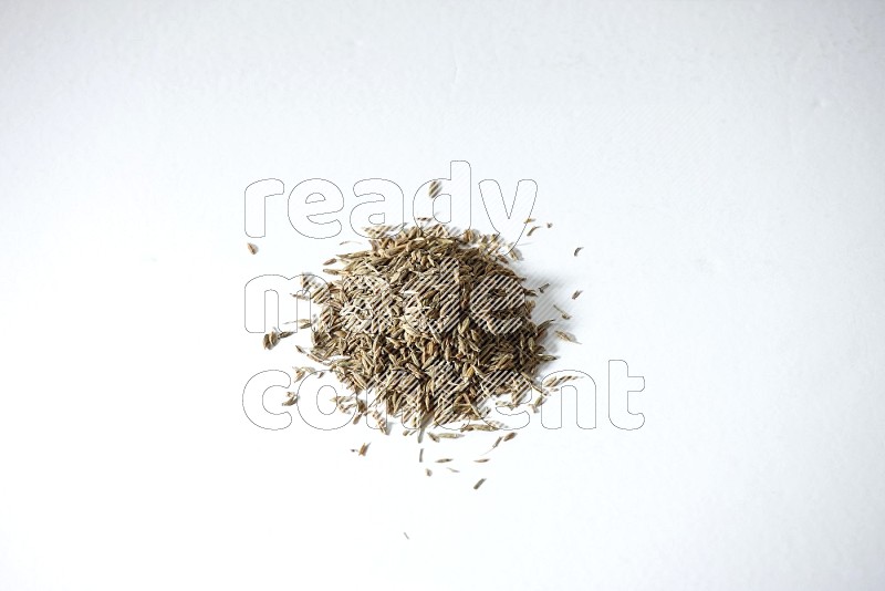 Cumin seeds on white flooring