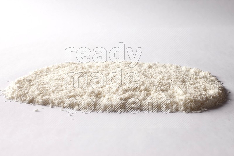 Desiccated coconuts on white background