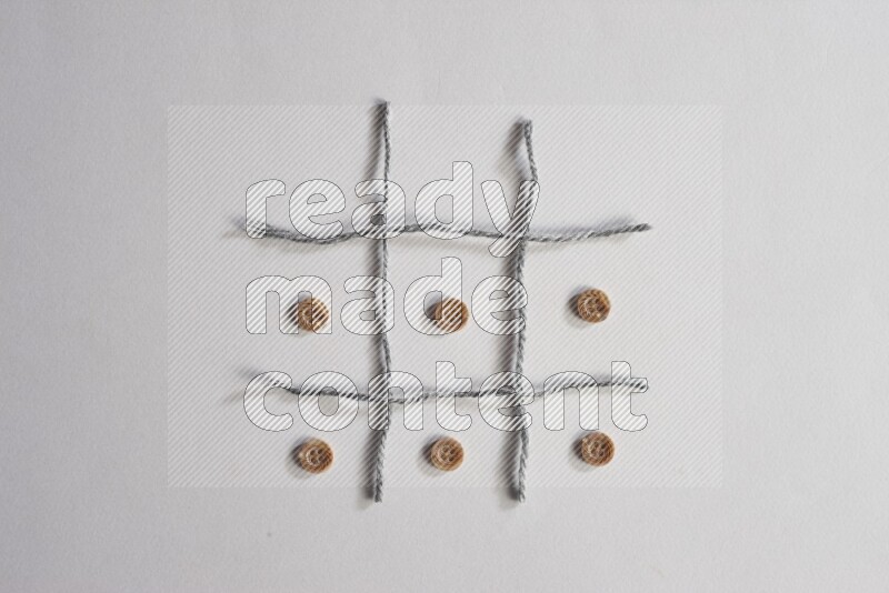 Brown buttons placed on grey background