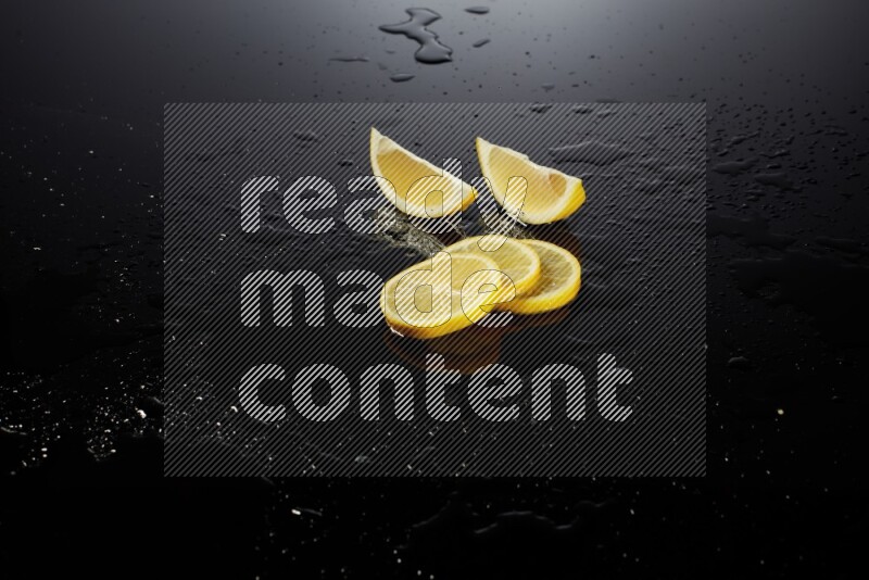 Lemon slices with water drops, and droplets on black background